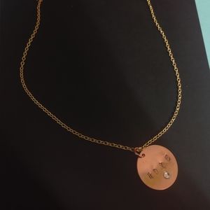 Gold necklace with rose gold pendant